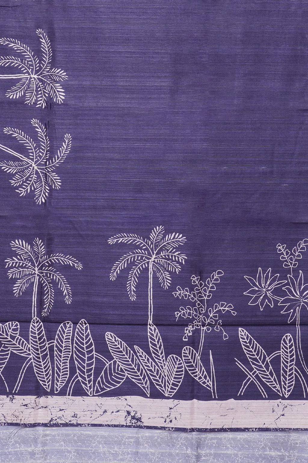 Deep indigo semi tussar with tropical palm sketch print and an elegant artistic border.